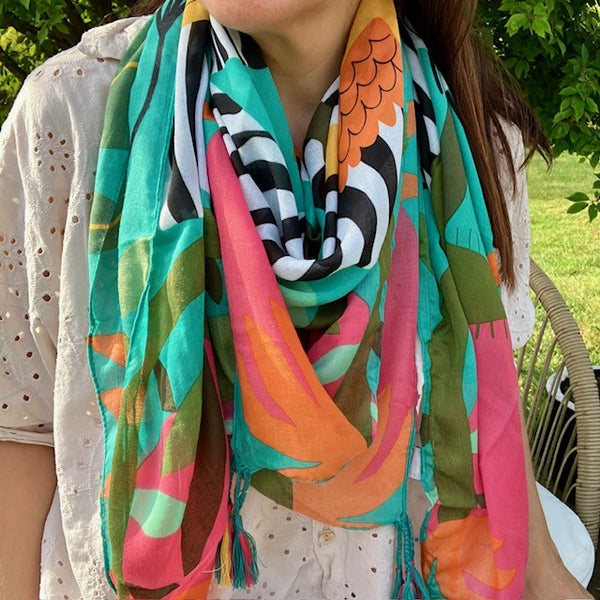 The Elio Scarf Green is ideal for keeping you cosy on your summer holidays