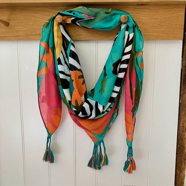 The Elio Scarf Green is bringing the summer to you! With it's bright colours, bold zebra print design, it is sunshine in a scarf!