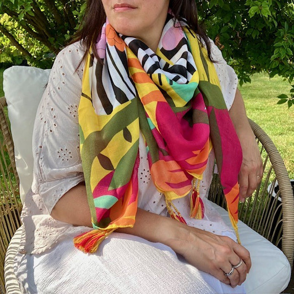 The Elio Scarf Yellow is a stunning bold scarf that will elevate your summer wardrobe
