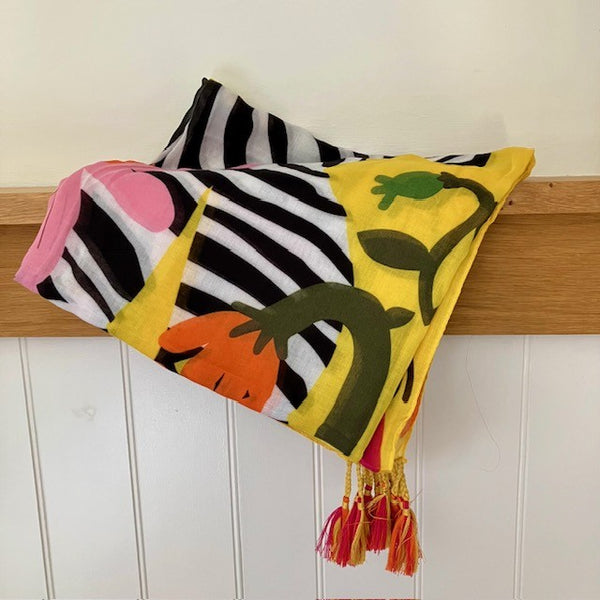 The Elio Scarf Yellow has super cute little tassels on each corner