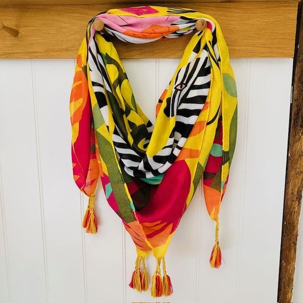 The Elio Scarf Yellow is bringing the summer to you! With it's bright colours, bold zebra print design, it is sunshine in a scarf!