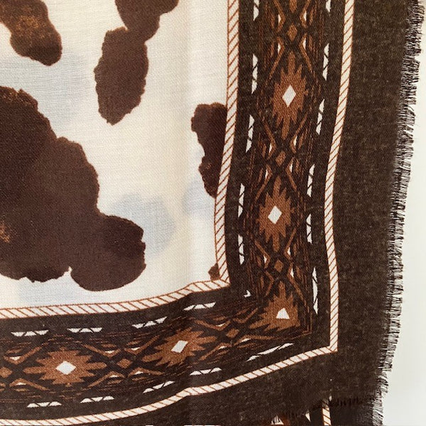 Large rectangular shape with frayed edges