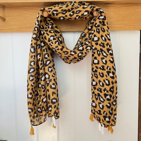 The Elora Scarf Camel in bold leopard print, is a stunning statement scarf that can be worn in multiple styles