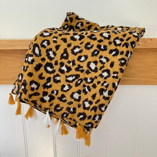 The Elora Scarf Camel is in the on trend animal print 