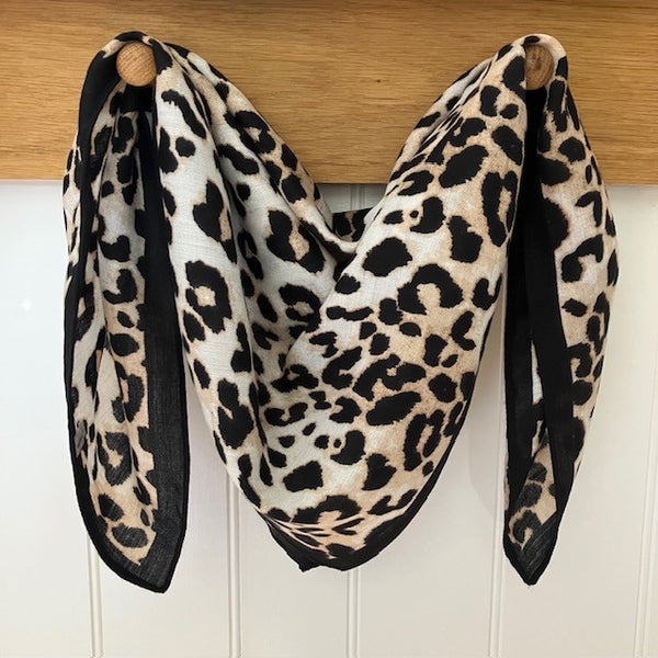 The Esper Scarf is a fabulous leopard print small square, ideal for styling into the on-trend small neck and triangle tied scarves.