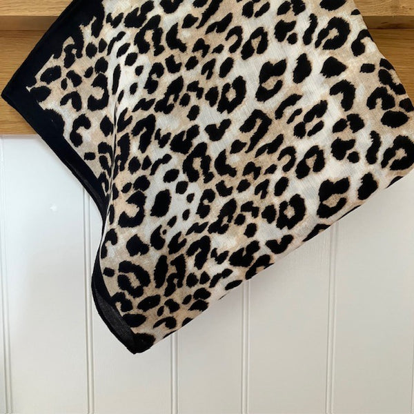 The Esper Scarf is black, camel and cream in colour