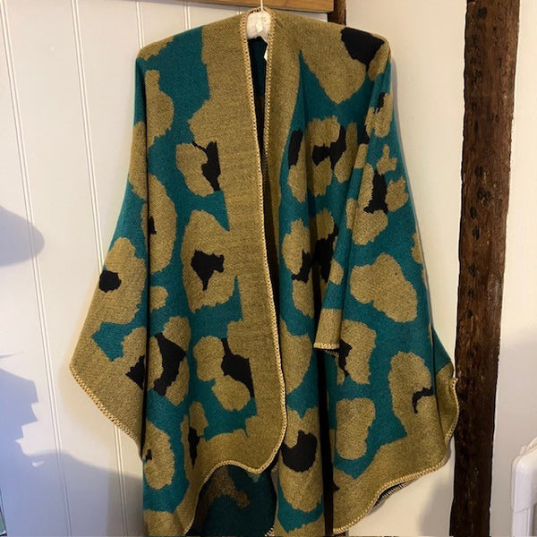 The Etta Cape Olive & Teal is an absolutely stunning leopard print accessory