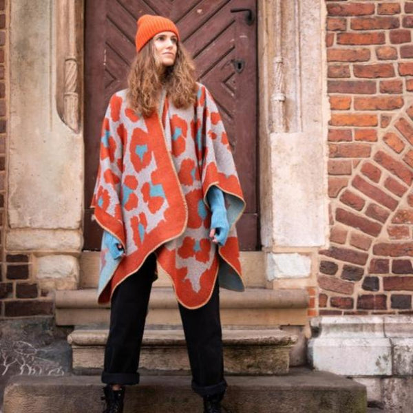 The Etta Cape Rust & Turquoise is an absolutely stunning leopard print accessory to add to your wardrobe 