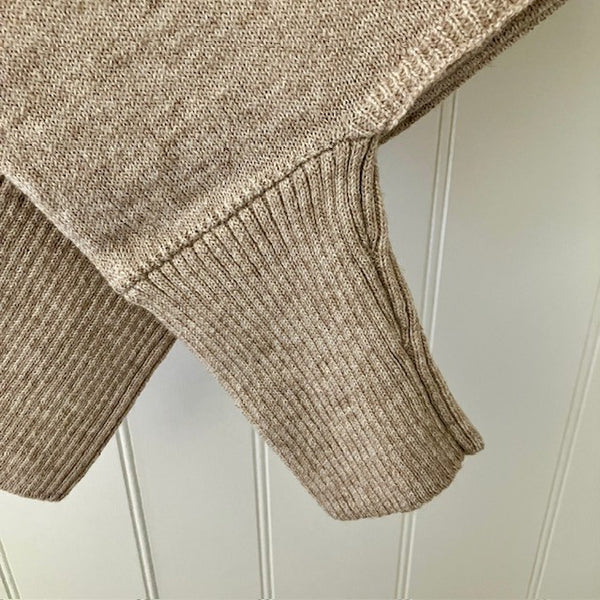 The Floella Poncho close up, arms have ribbed design