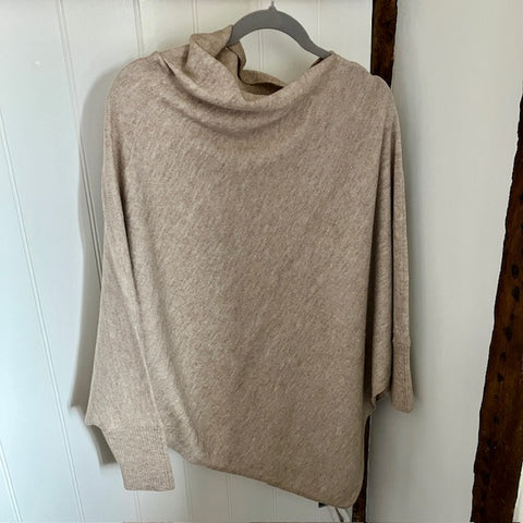 The Floella Poncho Beige is a fabulous design and perfect cosy accessory; a jumper, a poncho & a scarf in one!