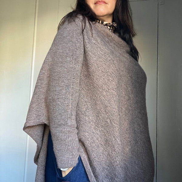 The Floella Poncho Brown has arms so can be worn as a jumper