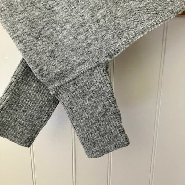 The Floella Poncho close up, arms have ribbed design