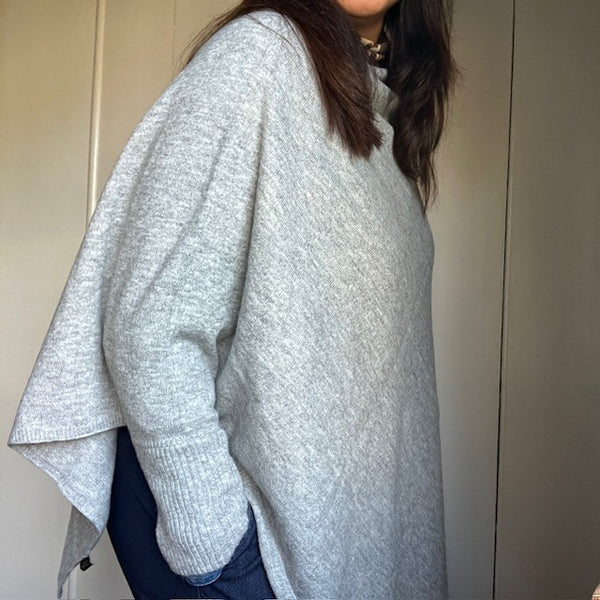 The Floella Poncho Light Grey has arms so can be worn as a jumper
