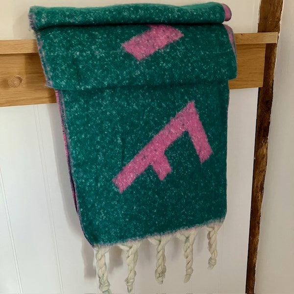 The Frida Scarf Green & Pink is a wonderfully soft, on-trend large statement scarf that will add warmth and character to any outfit