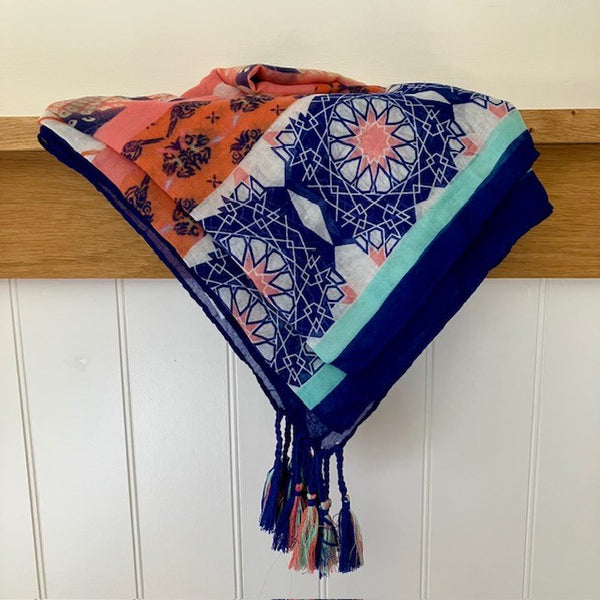 The Fuji Scarf is full of colour, pattern and has tassel detail
