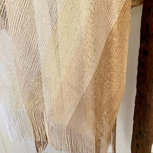 The Goldie Kimono is 100% Viscose and a breathable and see through material