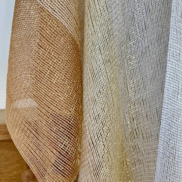 The Goldie Kimono is gold, cream and white