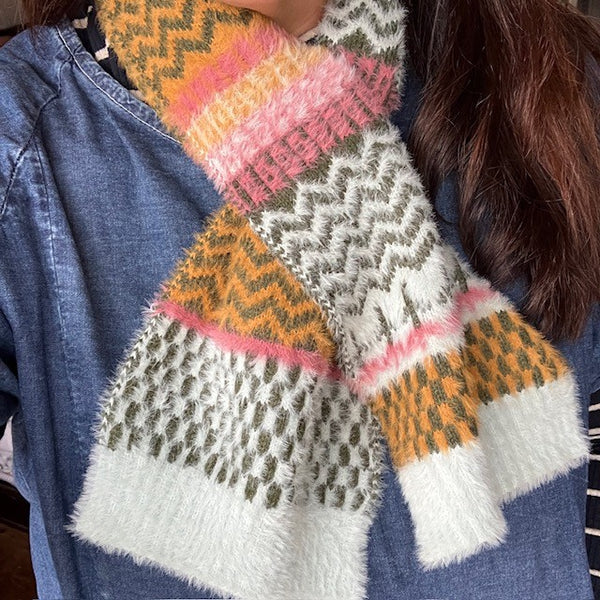 The Heather Scarf has the palest blue background with gorgeous nature inspired repeating patterns in green, pink and mustard