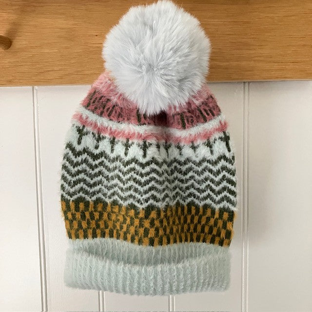 The Heather Hat is a wonderfully soft, cosy and warm pom pom style with a fabulous eye catching design