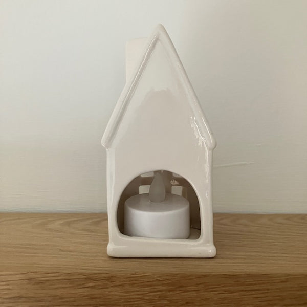 The Home Sweet Home Lantern - White is an adorable little ceramic house that provides a wonderful cosy glow