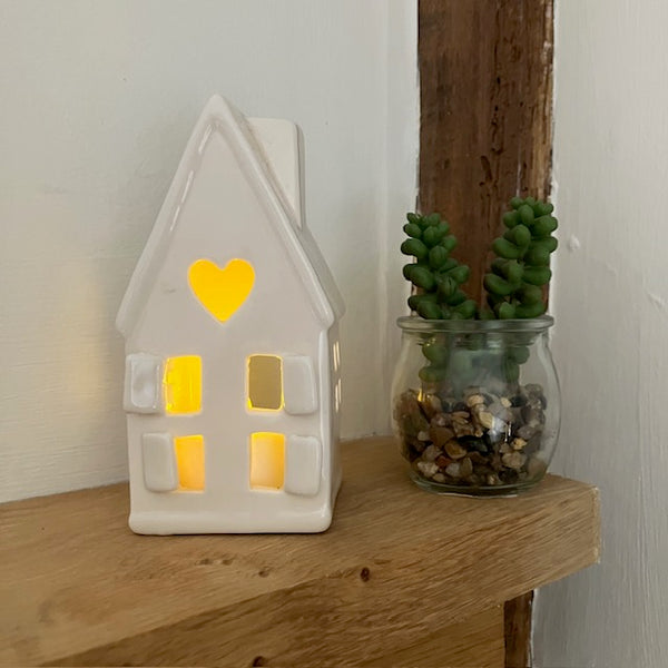 The Home Sweet Home Lantern - White is an adorable little ceramic house that provides a wonderful cosy glow