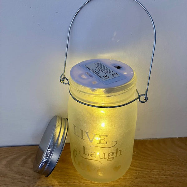 Live Laugh Love jar with lid off to show battery pack