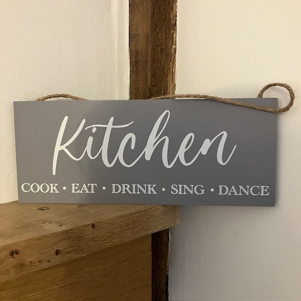 The Kitchen Sign will make the perfect gift for someone that loves to "Cook, Eat, Drink, Sing & Dance" in their kitchen