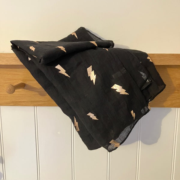 The Levina Scarf has a repeat lightening bolt pattern