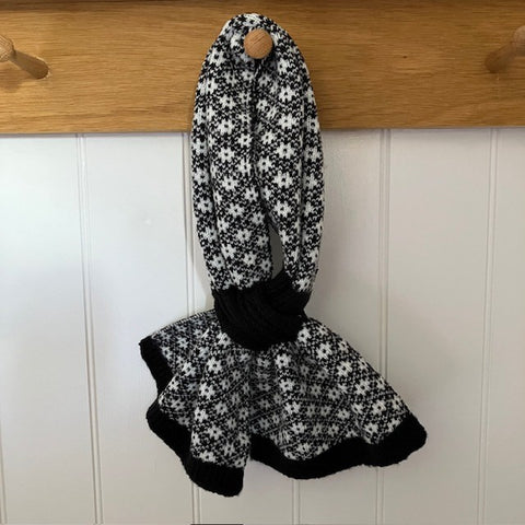 The Linnea Scarf is a unique pull through design that gives exceptional warmth to the neck