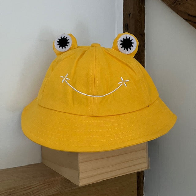 The Lolly Frog Bucket Hat Yellow is a super fun and cute sun hat for kids