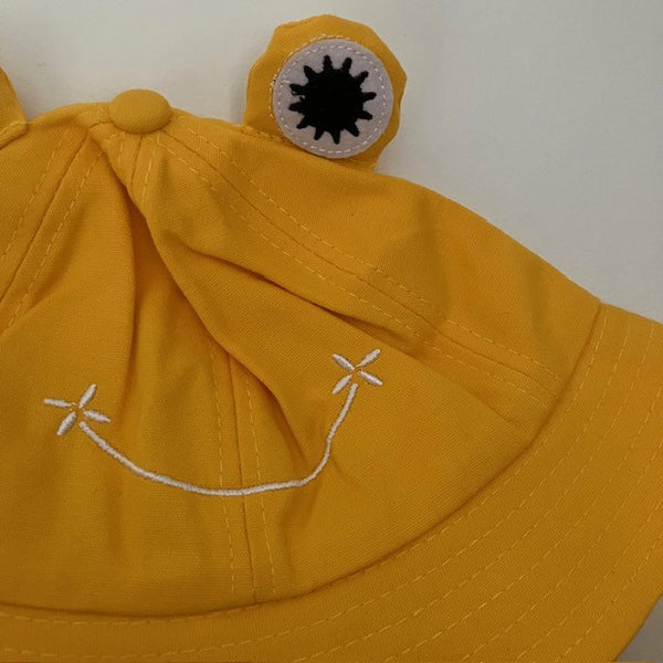 The Lolly Frog Bucket Hat Yellow is a super fun and cute sun hat for kids