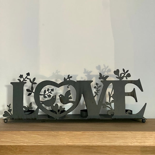 The 'Love' Metal Tea Light Holder is the perfect cosy home decor to add gorgeous ambient lighting to your home or dining table