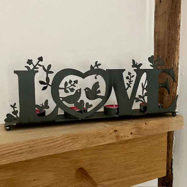 The 'Love' Metal Tea Light Holder is the perfect cosy home decor to add gorgeous ambient lighting to your home or dining table