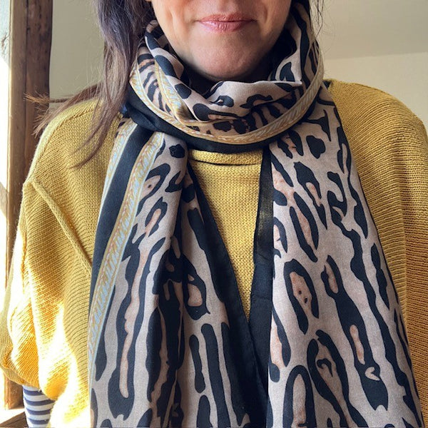 The Mari Leopard Print scarf is rectangular