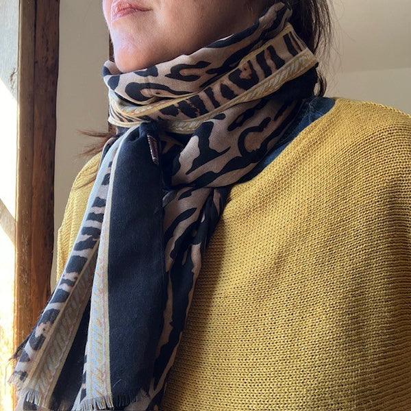 The Mari Leopard Print scarf is black colourway with a taupe background