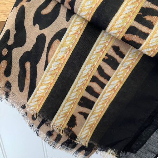 The Mari Leopard Print scarf has a rope pattern border