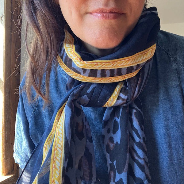 The Mari Leopard Print scarf is blue and yellow in colour