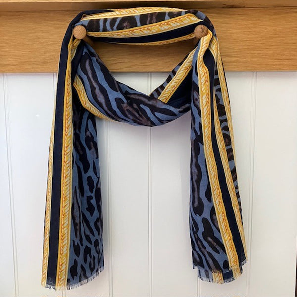 The Mari Leopard Print Blue is a must have animal print scarf that will elevate any outfit