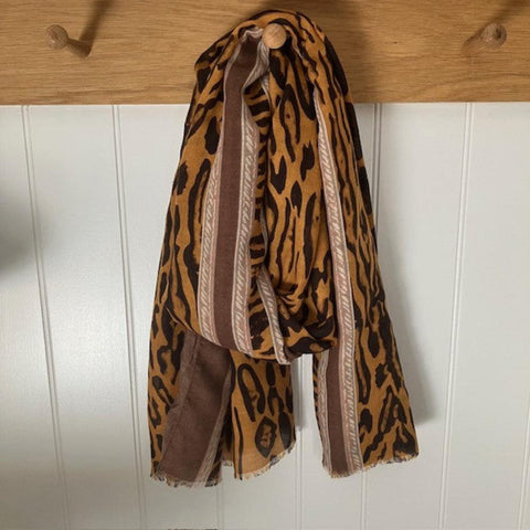 The Mari Leopard Print Brown is a must have animal print scarf that will elevate any outfit