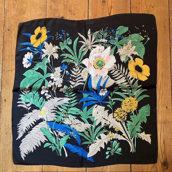The Meadow Scarf Black back ground really makes the beautiful flowers colours pop