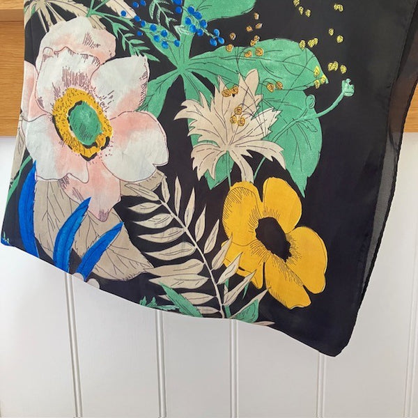 The Meadow Scarf is made out of polyester and has a silk feel