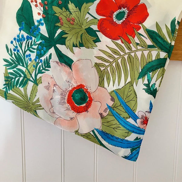 The Meadow Scarf is made from polyester and has a silk feel.