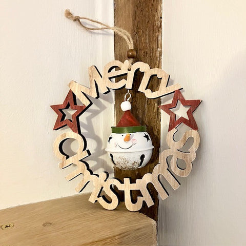 Wooden Christmas decoration with stars and a tin snowman ornament