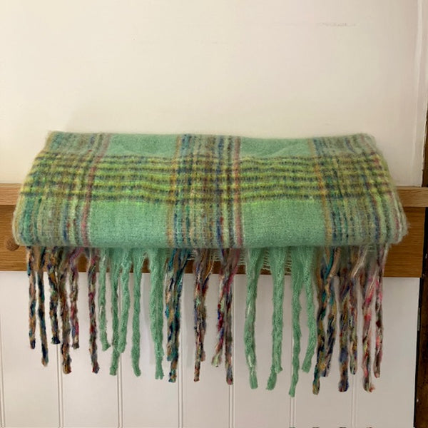 The Minty Scarf has long tassels
