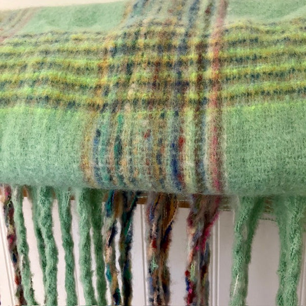 The Minty Scarf has a mint green colouring with lots of other colours running through the check pattern