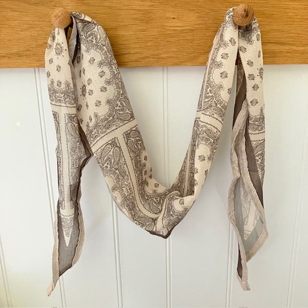 The Odette Scarf is truly unique with it's diamond shape and beautiful delicate design. Ideal for styling into the on-trend small neck and triangle tied scarves.