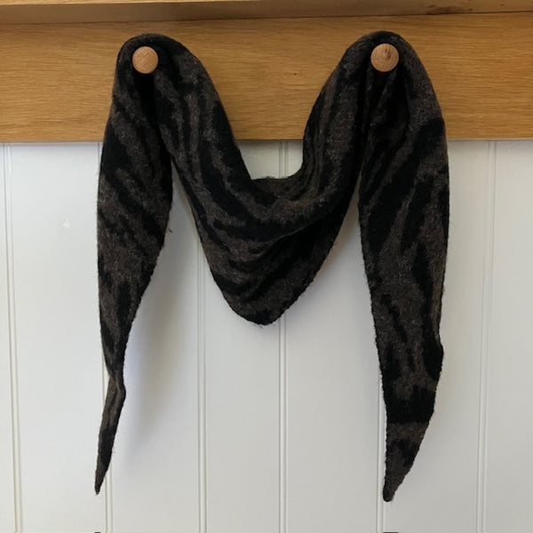 The Ophelia Scarf in the much sought after small knit triangle shape, has a super chic zebra print pattern that will instantly elevate your outfit.