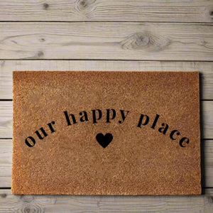 The Cosy Doormat 'Our Happy Place' will add a warm welcome to your home