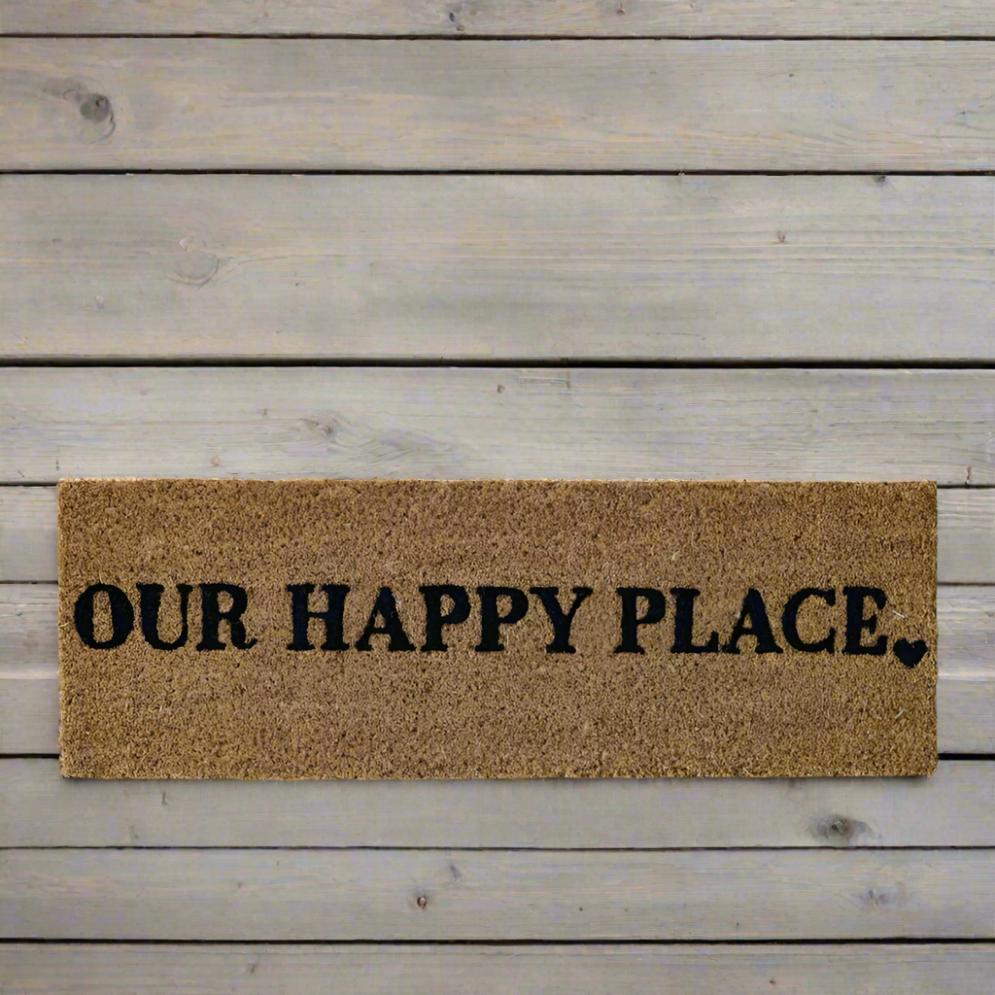 The Cosy Step Doormat 'Our Happy Place' will add a warm welcome to your home