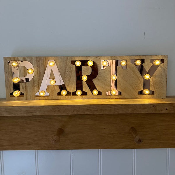 The Copper and Wood 'PARTY' Light Up Sign is a great gift for friends and family that love a get together